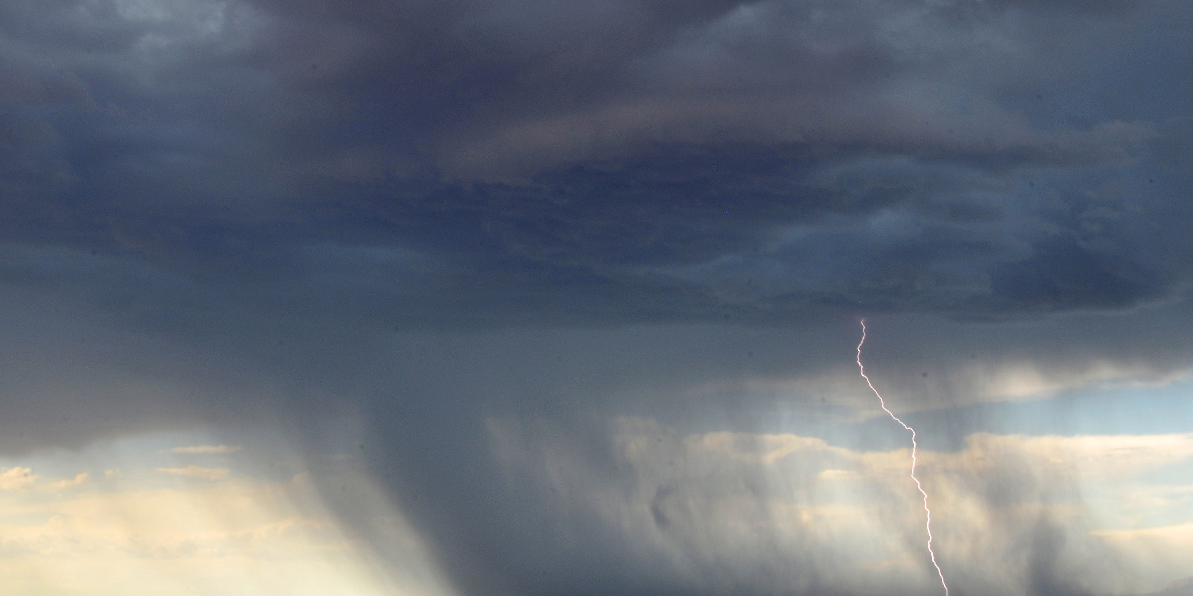 Storm clouds and lightning from the clouds to the ground