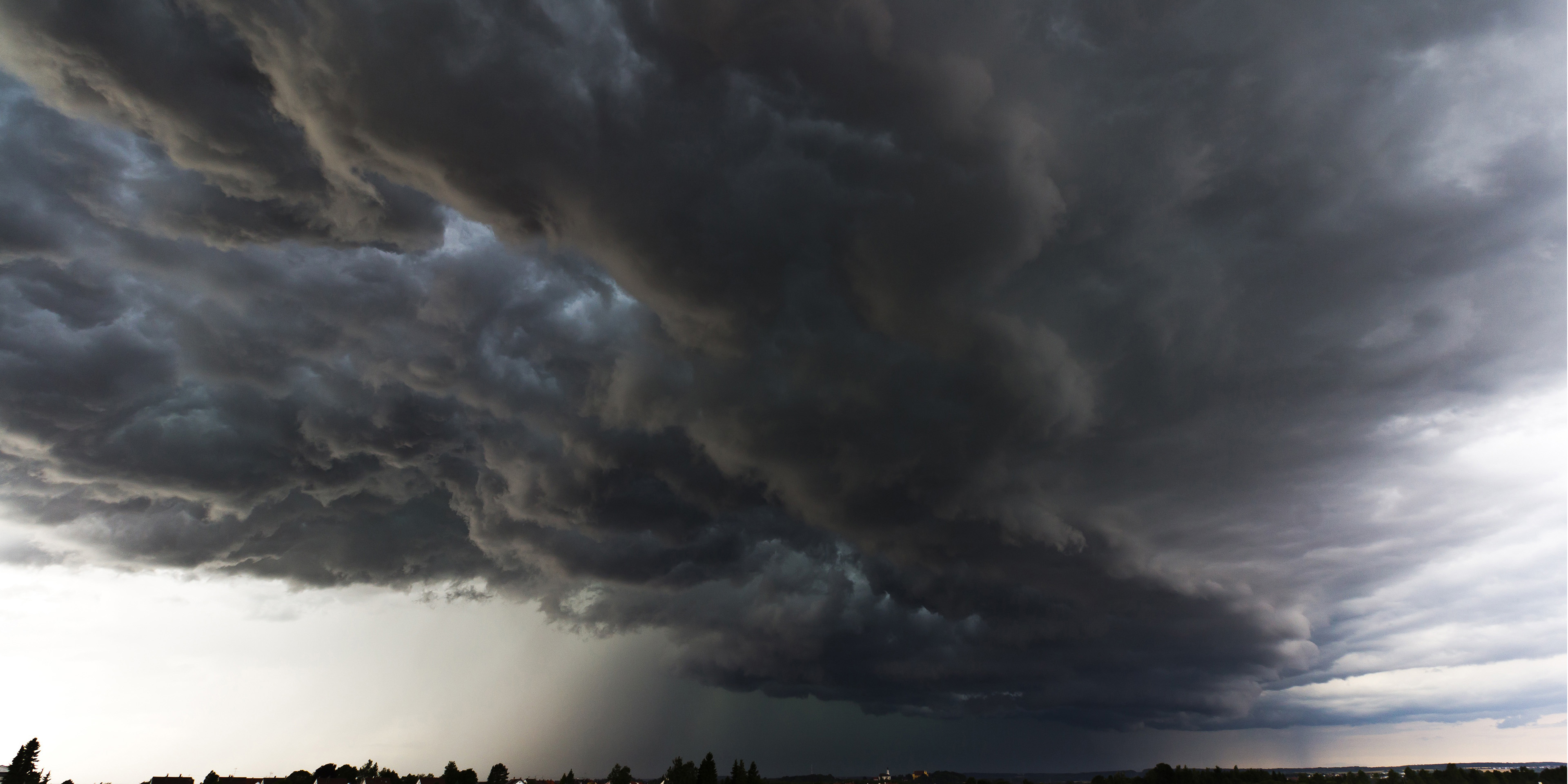 Thunderstorm cell moving across a field